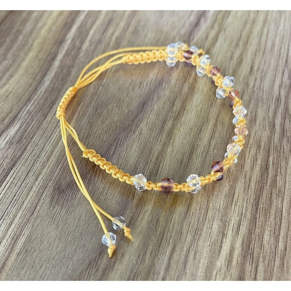 Yellow women's bracelet braided with crystals